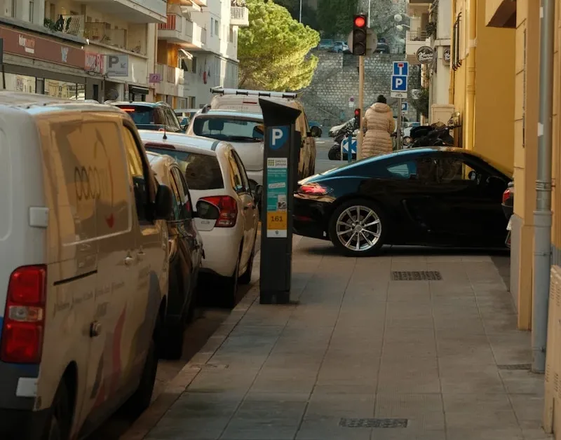 a city street with cars parked on the side of it