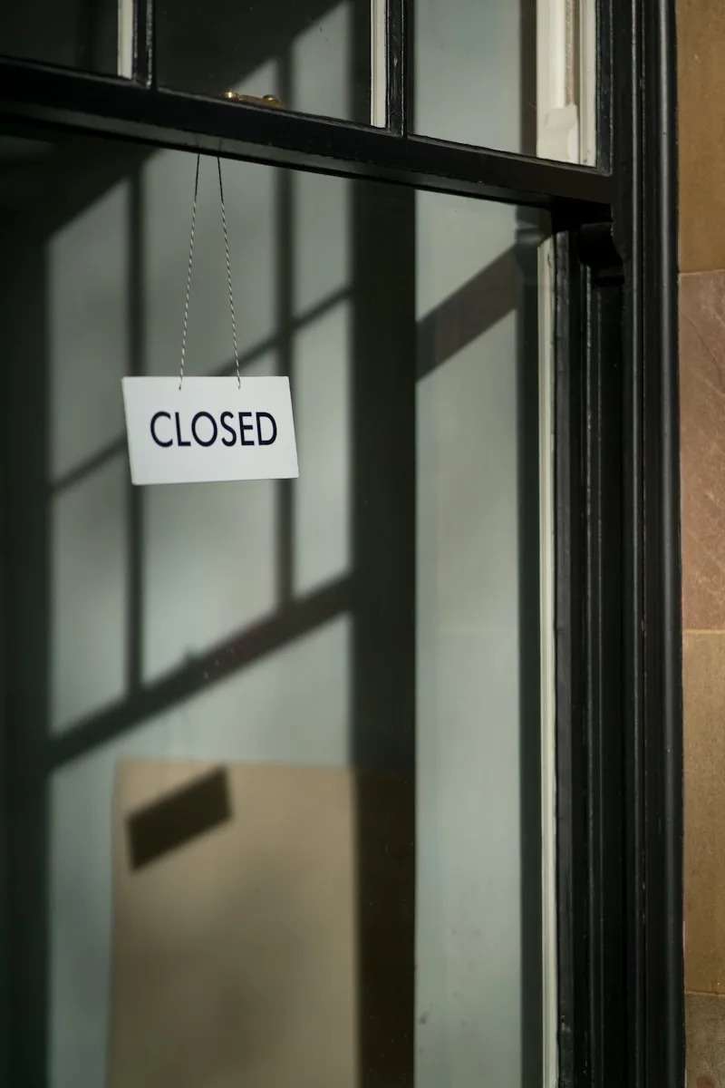 white closed hanging signage