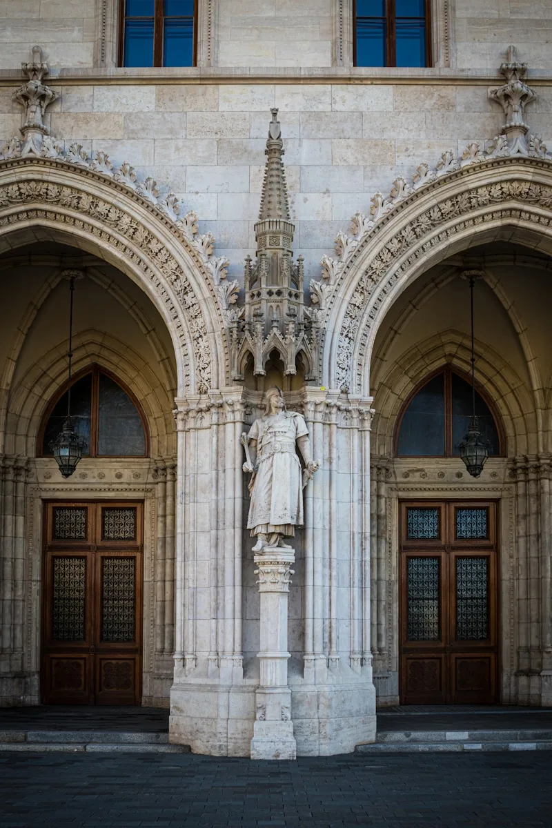 a statue in front of a building