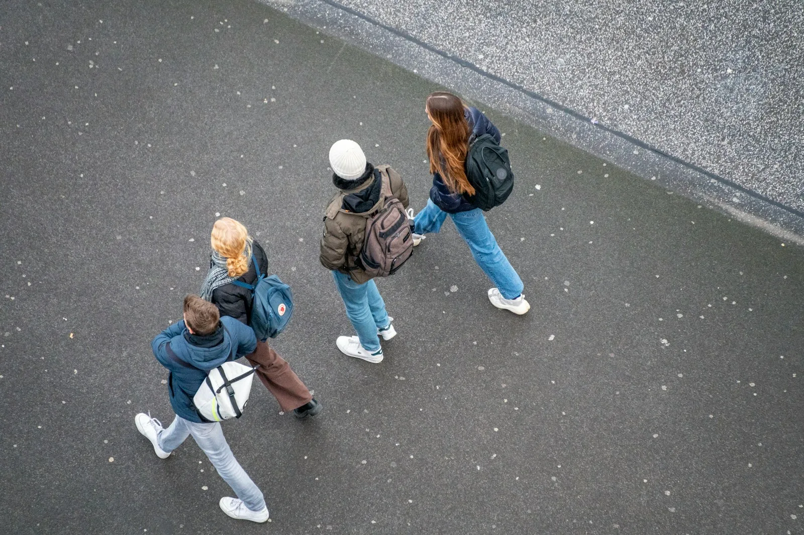 a group of people walking down a street