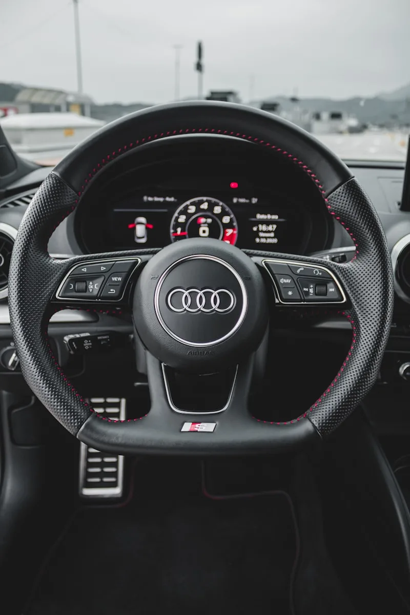 black and gray audi steering wheel
