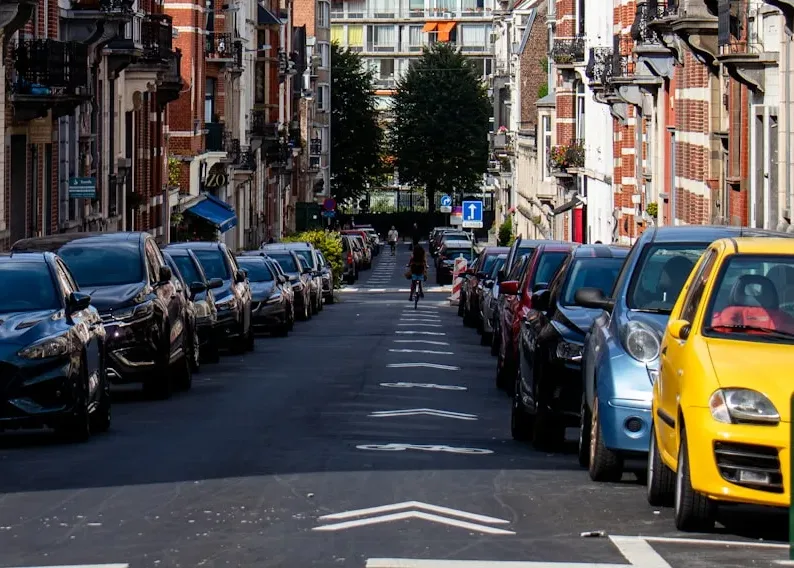 cars parked on street near buildings during daytime