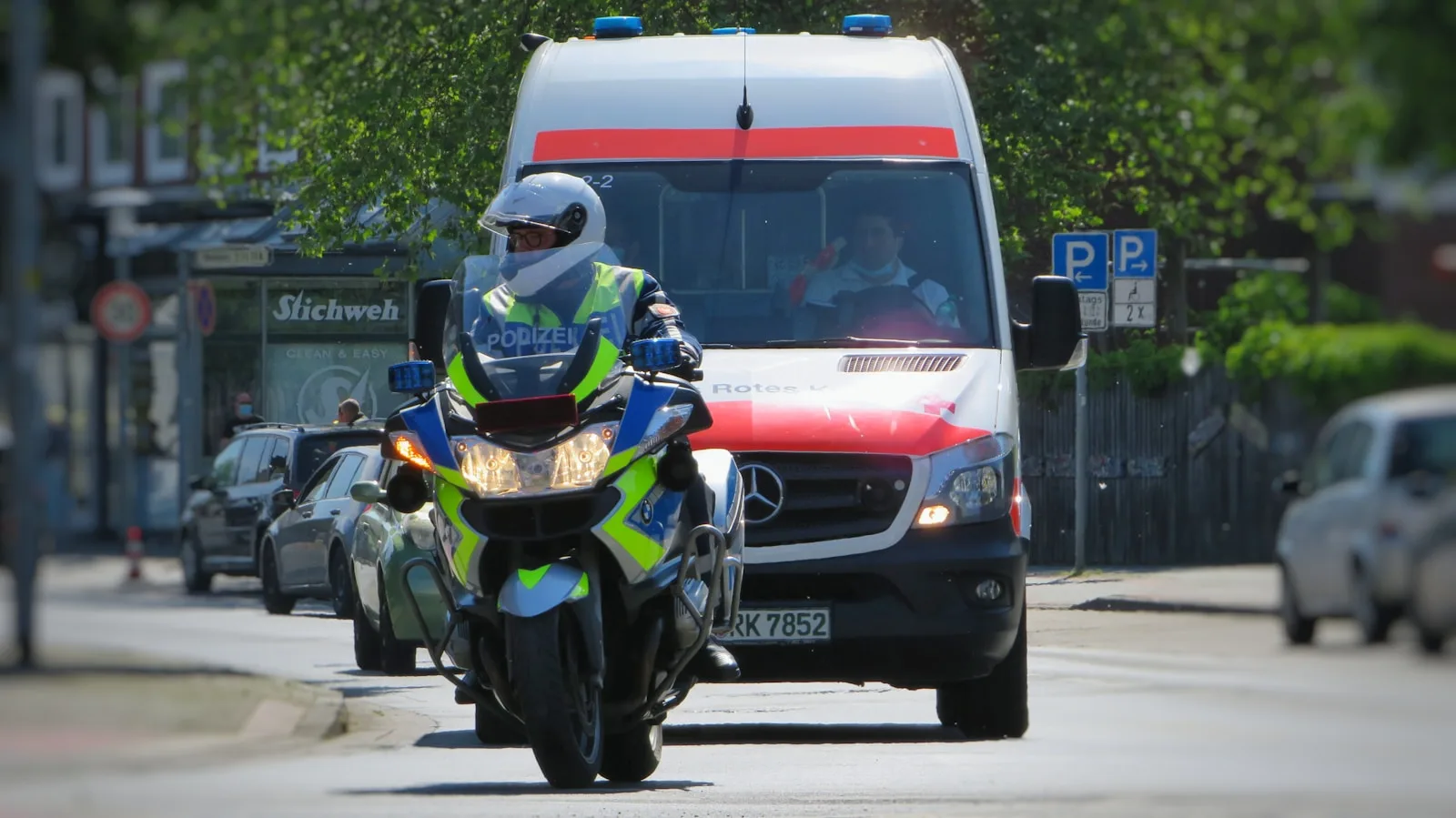 man in green helmet riding on yellow and black motorcycle during daytime