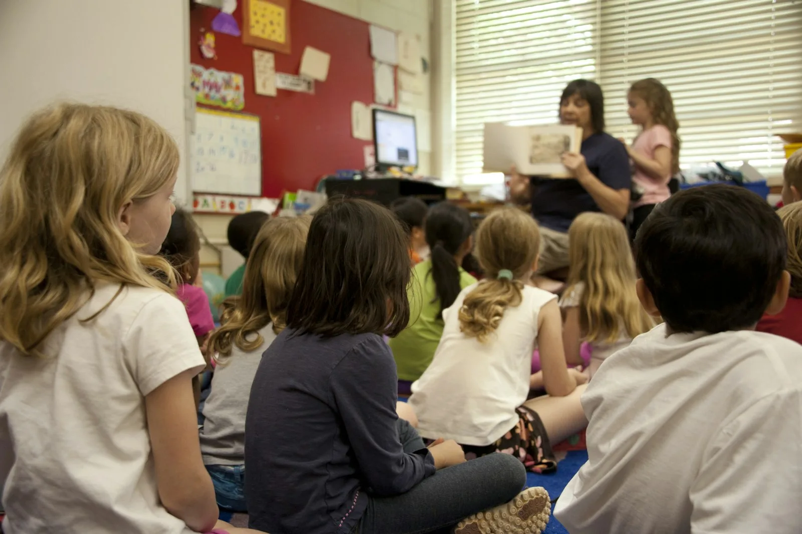 teacher school class people sitting on chair inside room