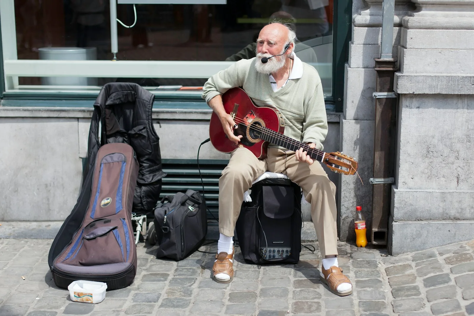 man in white dress shirt playing guitar