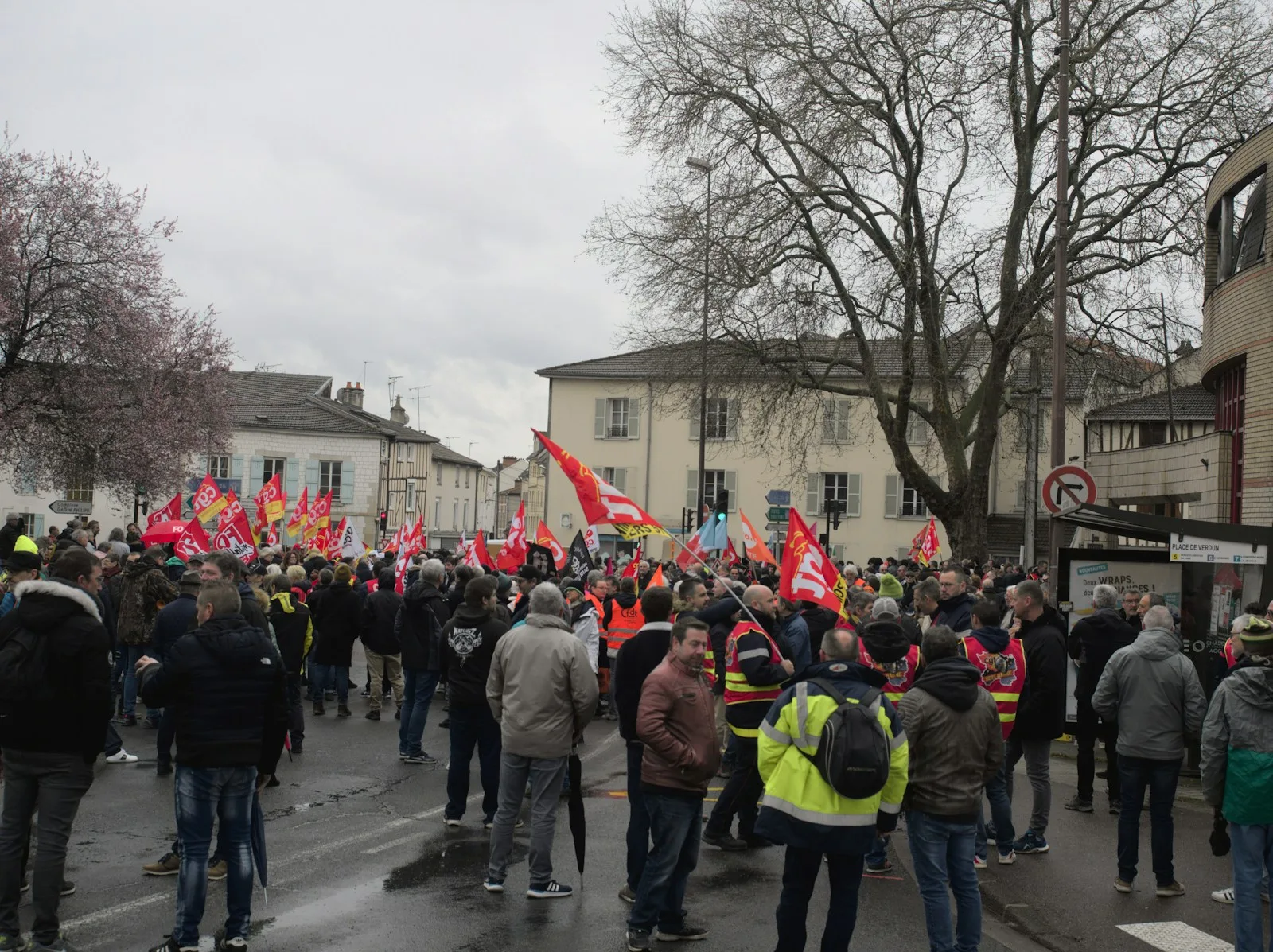 a large group of people standing on a street