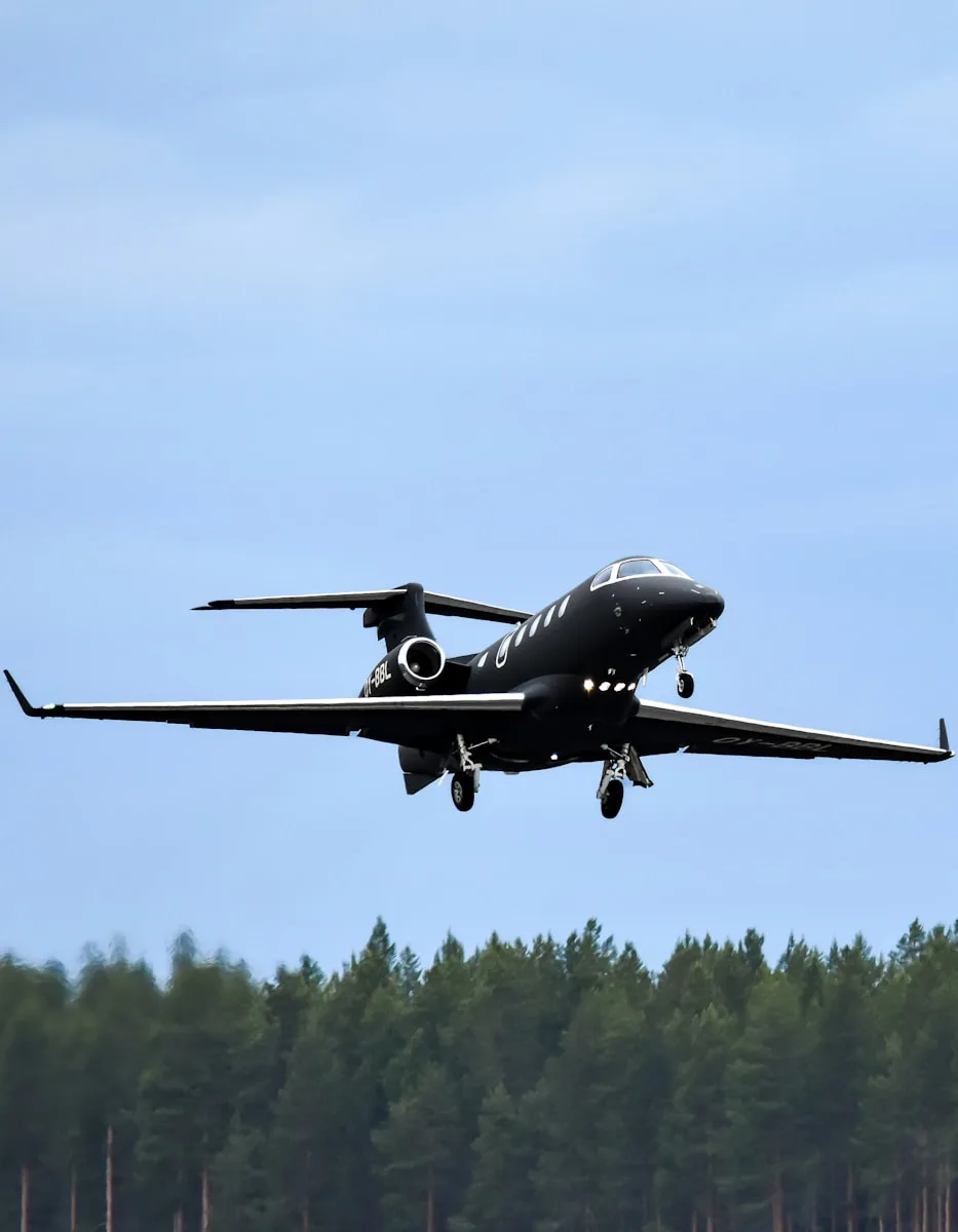 A black jet is approaching for landing.