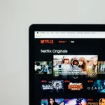 person using silver and black laptop computer