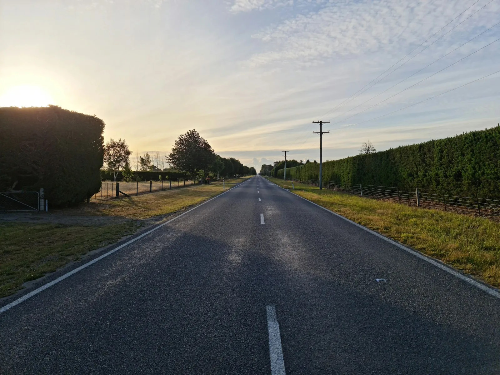 gray asphalt road under blue sky during daytime