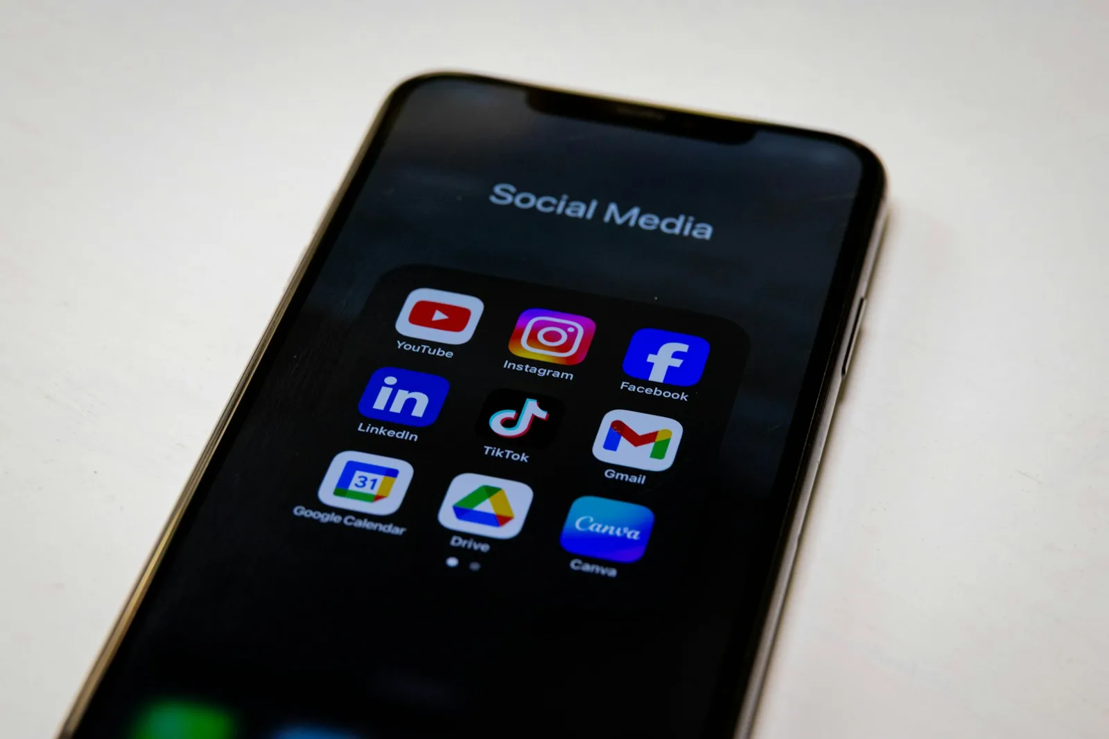 Social media apps are displayed on a smartphone.