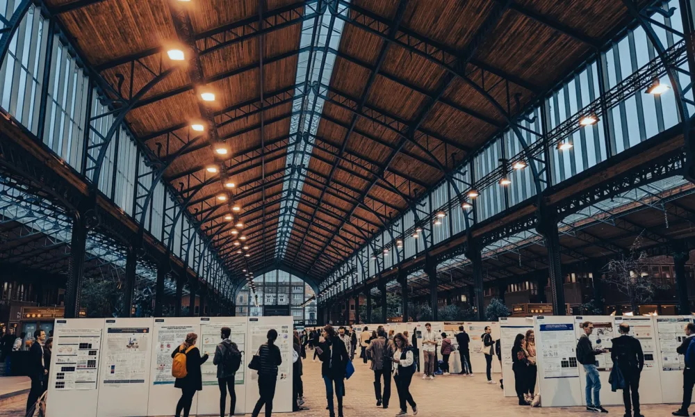 a group of people standing inside of a building