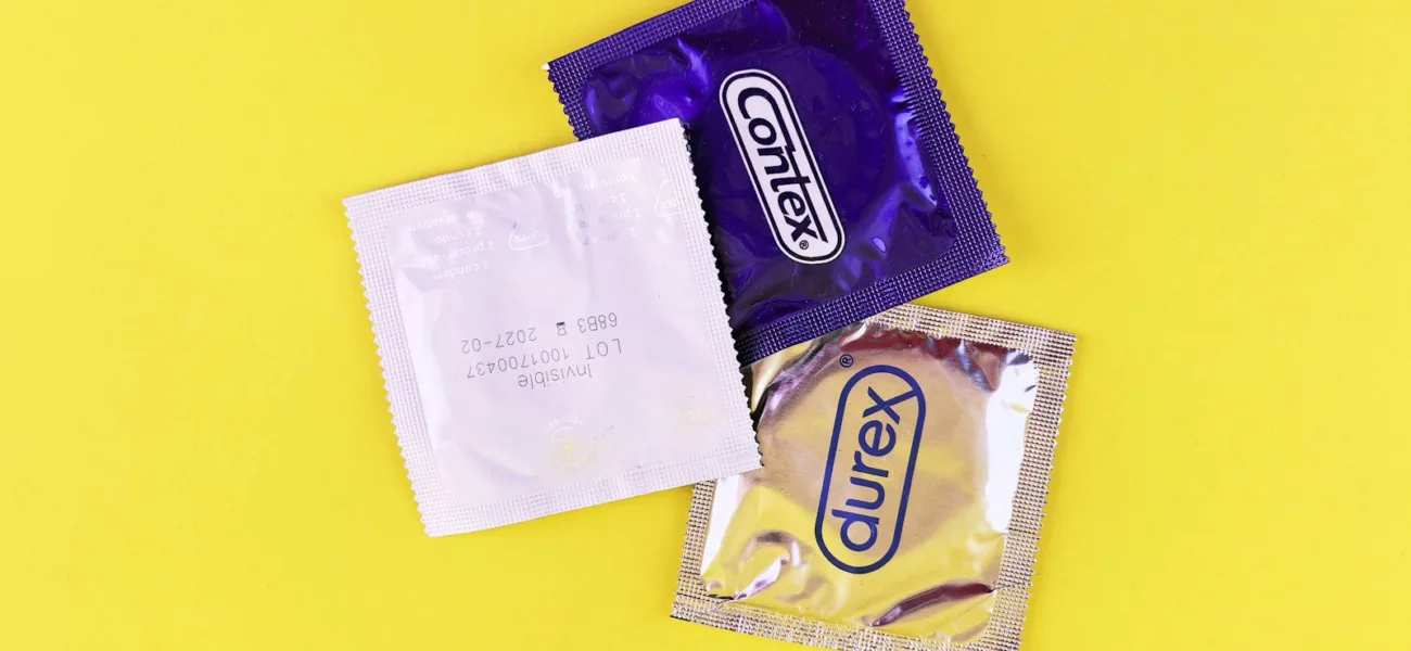 A couple of bags of candy sitting on top of a yellow table